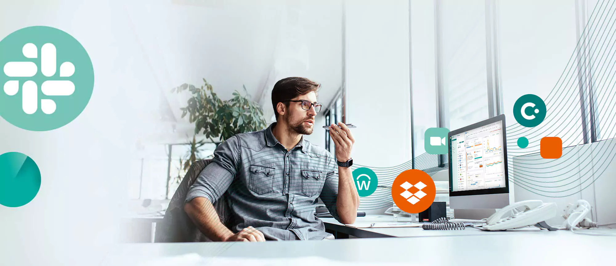 Young businessman talking on mobile phone in office while using Zylo platform