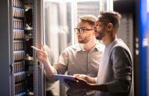 On-premises software, two IT professionals in server room.